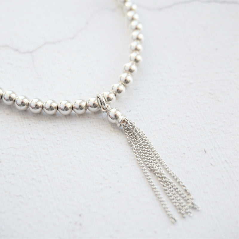 Sterling Silver Stretch Bracelet With Tassel Charm